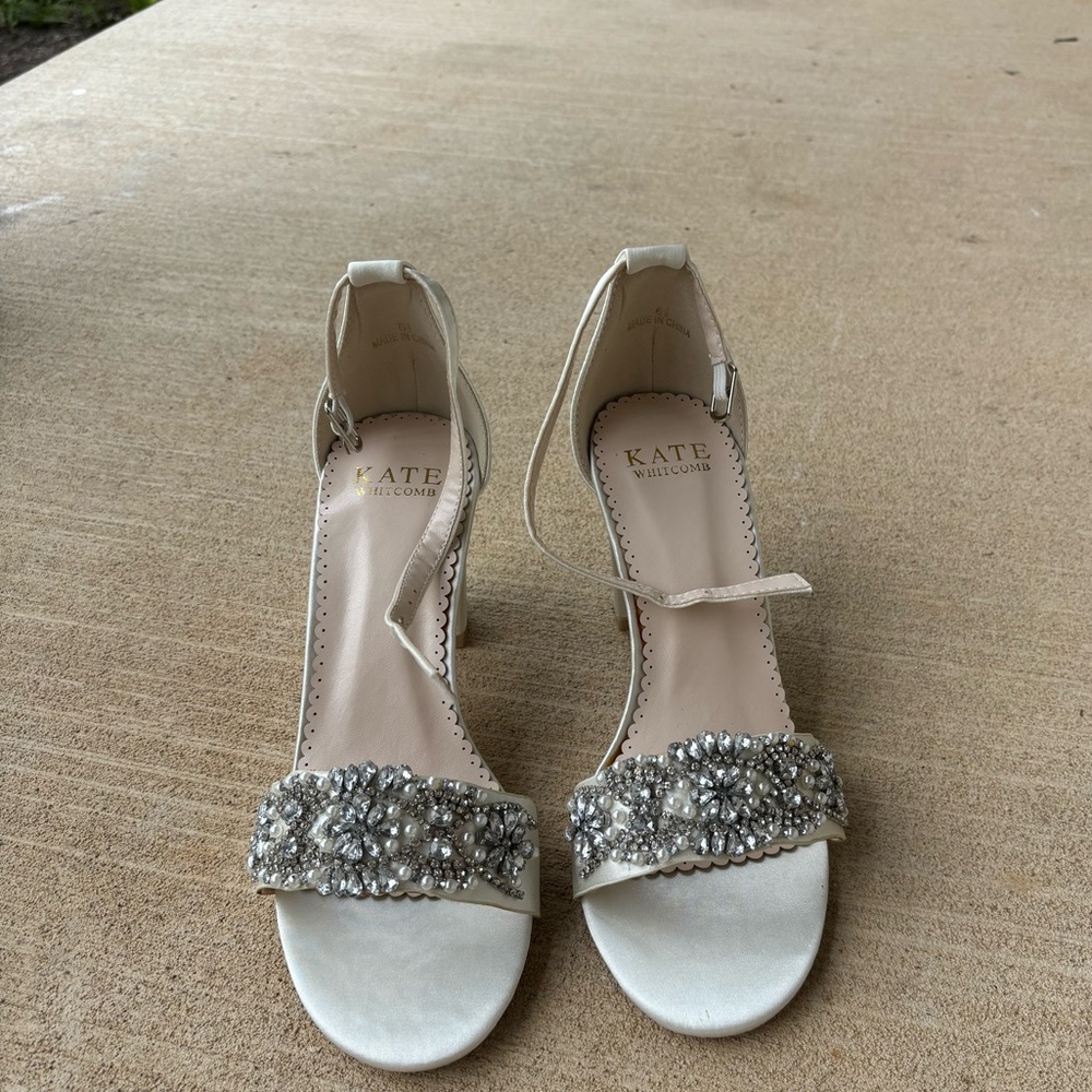 Brand new. Never worn. Kate Whitcomb wedding shoes.